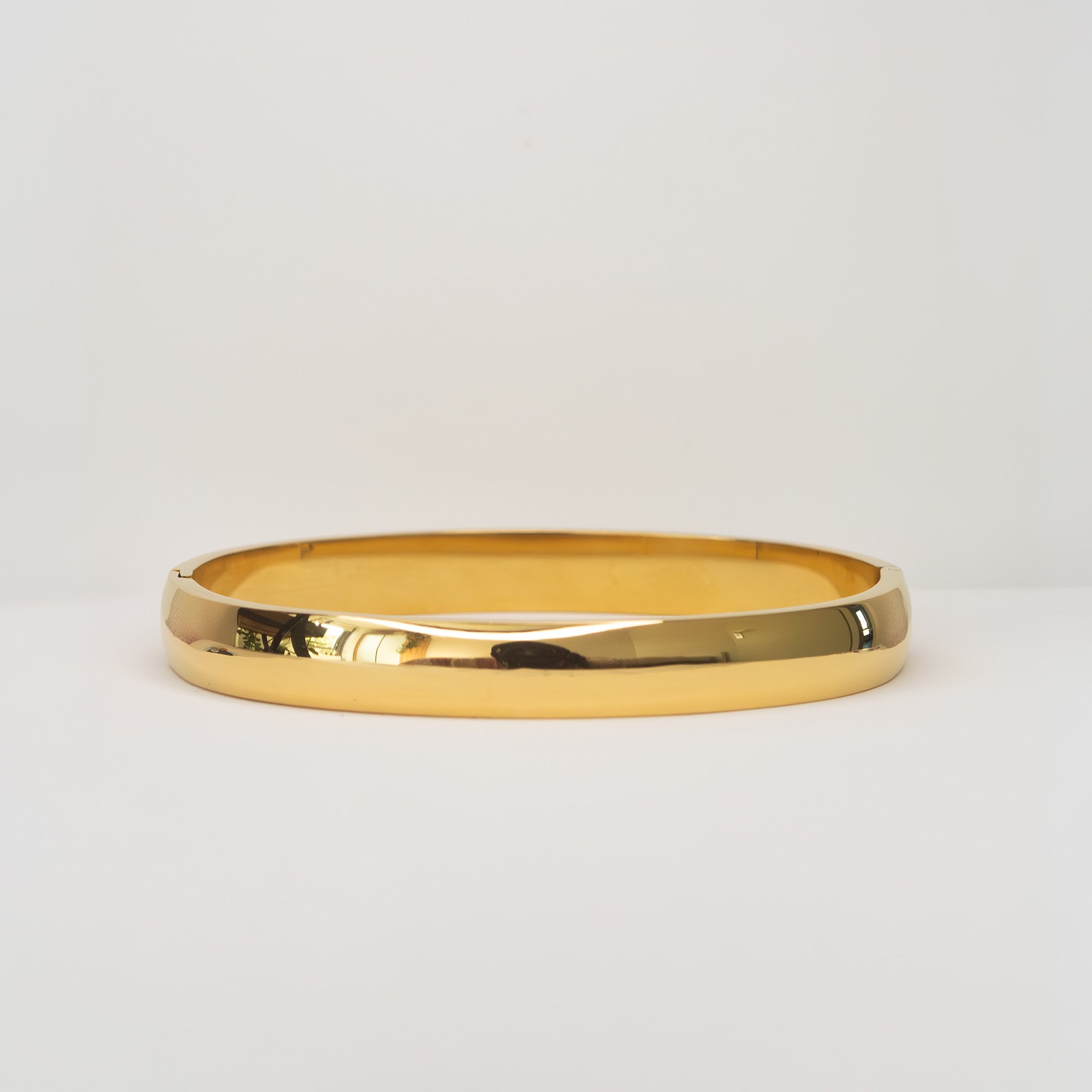 Aurea Cuff Bracelet gold wide flat lay — Tamola Jewellery