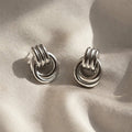 Riva Sculptural Knot Earrings silver close-up detail — Tamola Jewellery
