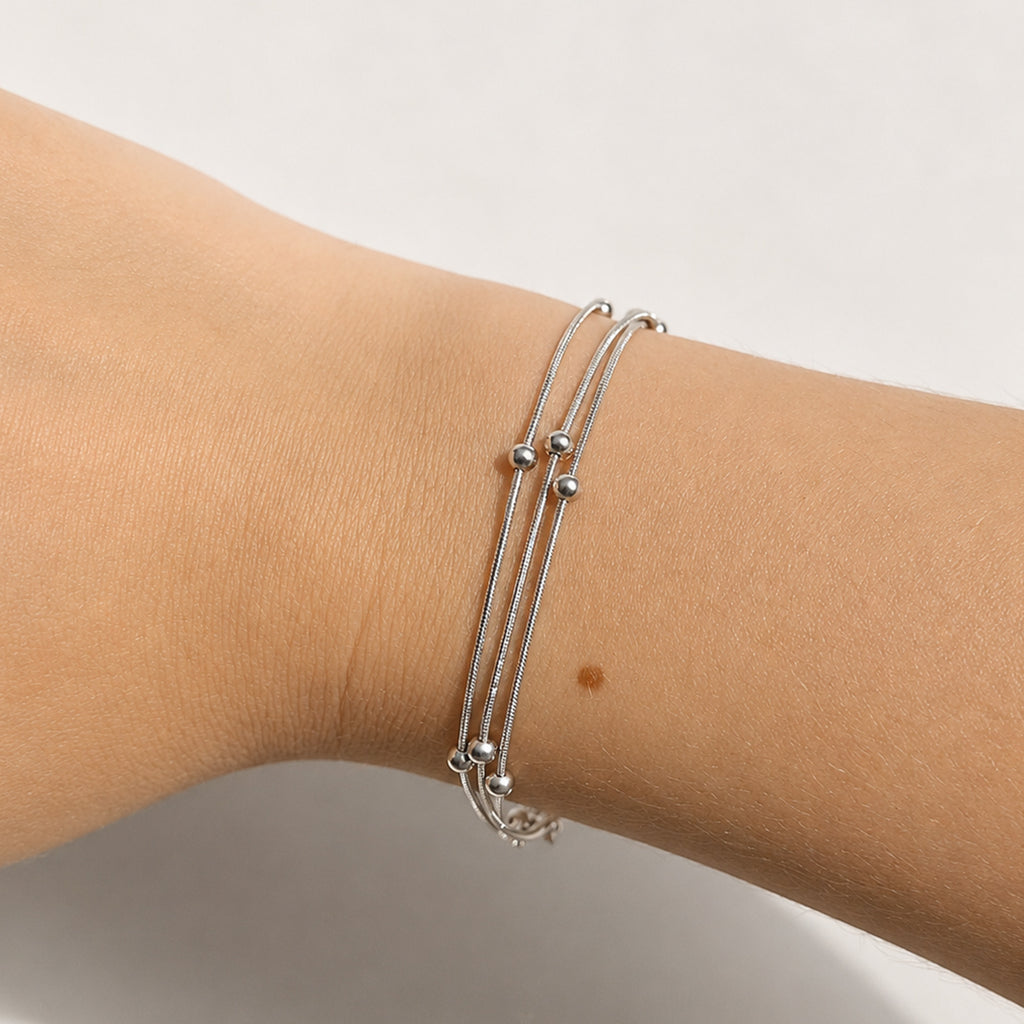 Sylva Three Layer Bracelet silver on model wrist — Tamola Jewellery
