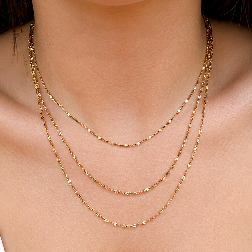 Elara Layered Necklace three delicate chains gold stainless steel on model — Tamola Jewellery