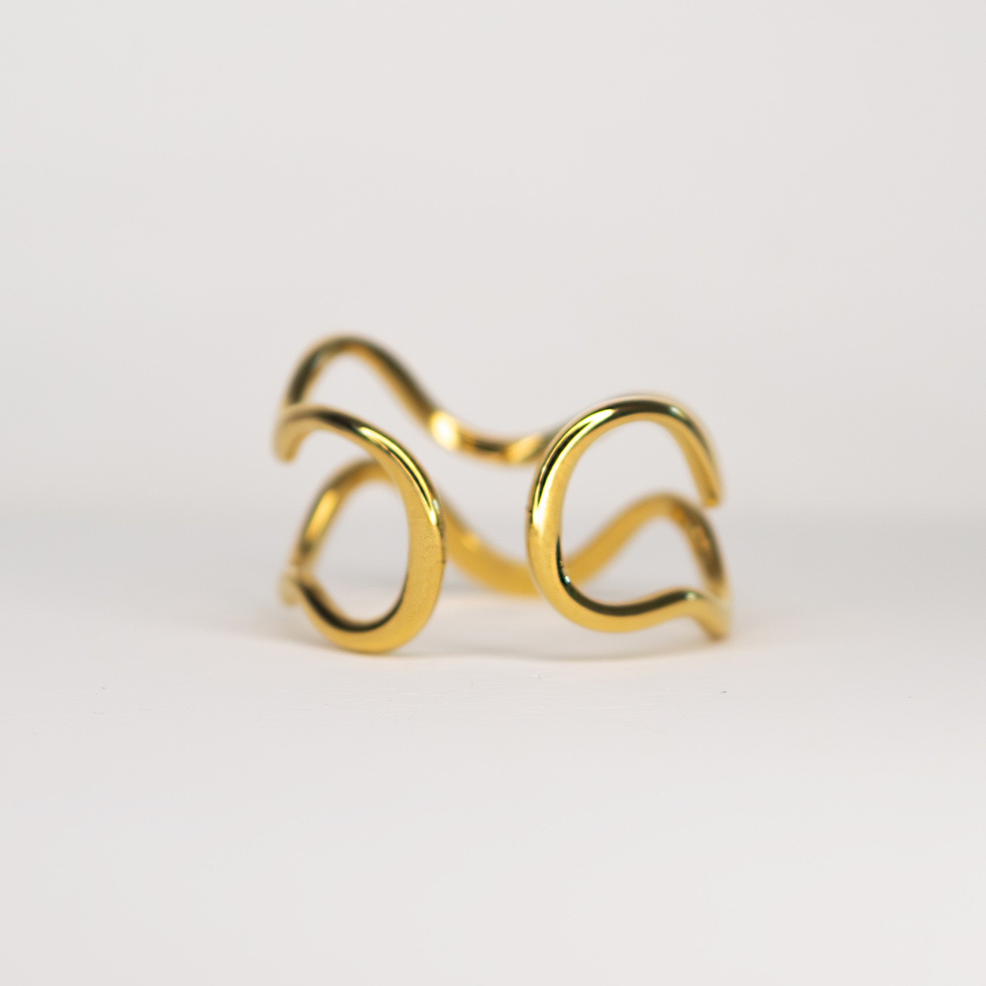 Nova Open Sculptural Ring gold stainless steel on model hand — Tamola Jewellery