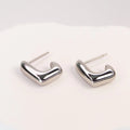 Solène Sculptural Huggie Earrings silver stainless steel — Tamola Jewellery